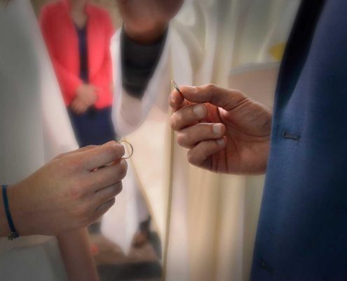 Wedding ring exchange during church ceremony